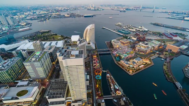 day to night time lapse of Yokohama harbor at Minato Mirai waterfront district, Japan