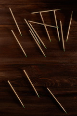 Toothpicks are loose on a wooden table