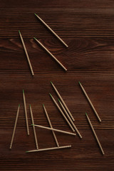 Toothpicks are loose on a wooden table