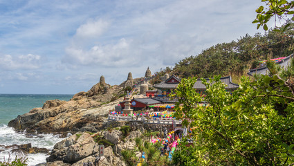 Naklejka premium Panoramic view to Haedong Yonggungsa Temple during celebrations to buddhas birthday on a clear day. Located in Gijang-gun, Busan. South Korea, Asia.