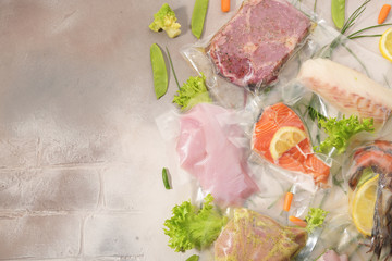 Sous Vide cooking concept. Vacuum packed ingredients arranged on light background.