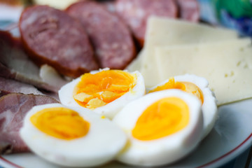 Homemade food from grandmother. Sausage, cheese, boiled eggs. Breakfast at Easter.Ukrainian folk cuisine