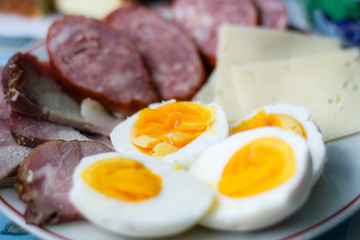 Homemade food from grandmother. Sausage, cheese, boiled eggs. Breakfast at Easter.Ukrainian folk cuisine