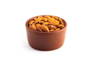 Bowl full of almonds and isolated on a white background
