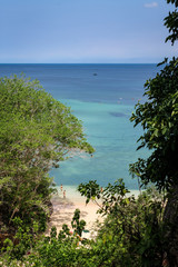 PADANG PADANG BEACH, ULUWATU, BALI, INDONESIA - November 30, 2013: View of Padang Padang Beach with pristine waters and blue skies.