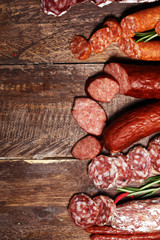 cold meat assortment with delicious salami and  fresh herbs . Variety of meat products including coppa and sausages