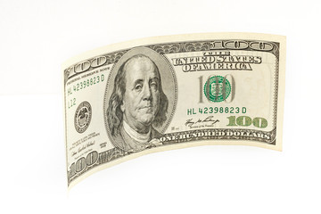 Close up hundred dollar banknote on white background