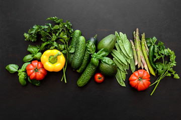 Obraz na płótnie Canvas Dark culinary background with fresh produce