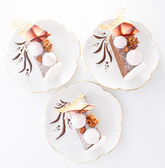 Delicious and beautiful chokolate cakes on three white plates