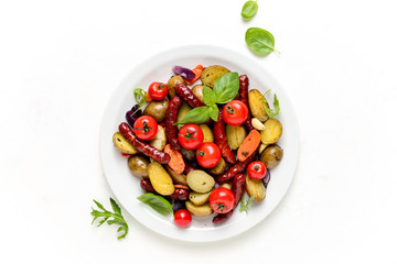 Sausages roasted with vegetables, view from above