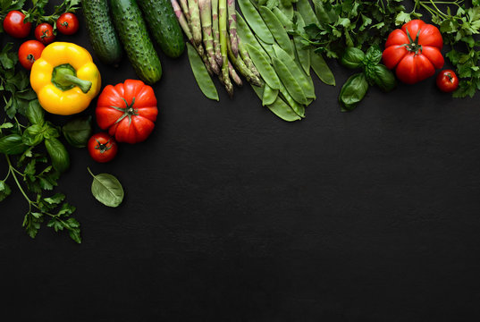 Dark culinary background with fresh produce