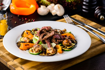 Beef salad roast beef, roasted sweet peppers and grilled onions.