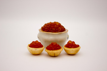 Luxury Red Caviar in the bowl. Food photo concept.
