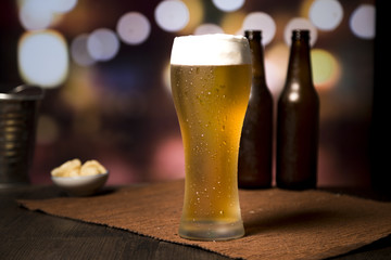Beer glass in front of blurred background
