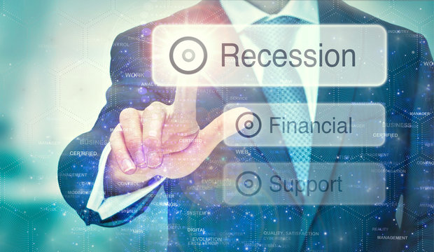 A business man selection a Recession button on a futuristic display with a concept written on it.