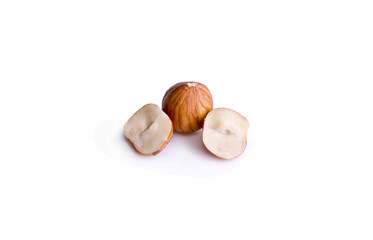 peeled hazelnut in a cut on a white background
