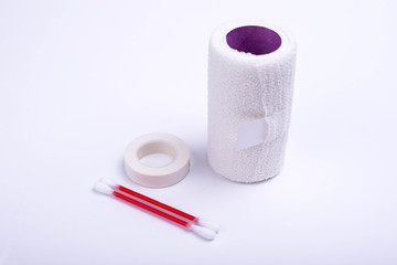medical bandage, medical plaster, cotton swabs on a white background
