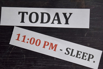 Fototapeta premium Close up making agenda Daily schedule on personal organizer. Business and entrepreneur concept. Isolated on black background