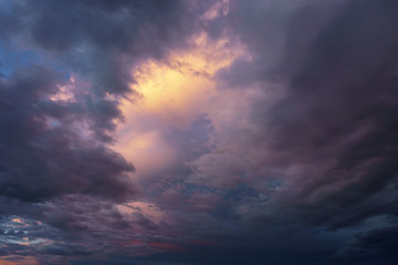 Fototapeta na wymiar background of cloudy dark sky at sunset
