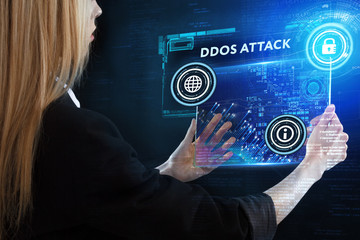 The concept of business, technology, the Internet and the network. A young entrepreneur working on a virtual screen of the future and sees the inscription: Ddos attack