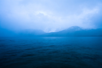 Clouds mist over Caburga lake, southern Chile, Araucania Region, Chile, South America