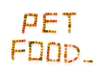letters from dry pet food isolated on white background