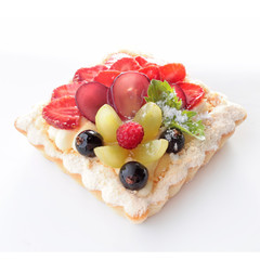 Sweet bright tartlet with berries and mint