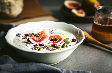 Oatmeal with fresh Fig,Pomegranate and Chai seed topping