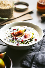 Oatmeal with fresh Fig,Pomegranate and Chai seed topping