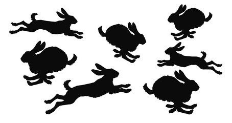 set black isolated silhouettes of galloping hares on white background