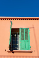 Fototapeta na wymiar Green Shutters on a Window in Marrakech Morocco