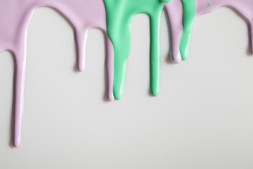 white background with purple and green flowing paints