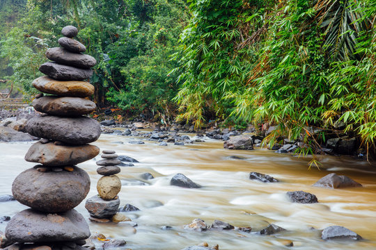 Stacked zen stones at Tegenungan Waterfall at Bali, Indonesia © BGStock72