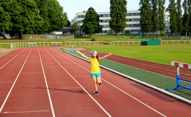 Little girl have fun on the stadium