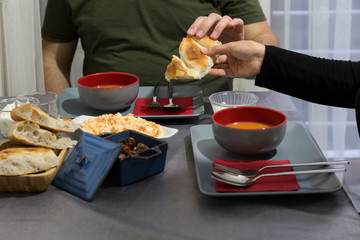 very nicely prepared dining table for special, valentines' day or Ramadan or Christmas in the luxury living room. soup,bread,salads on the table for party time.