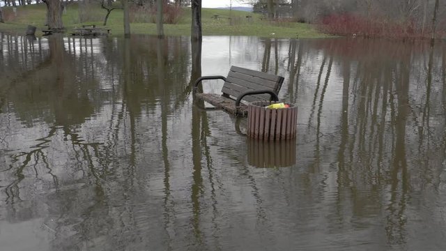 A park is flooded after record rain and snow fall due to climate change weather patterns