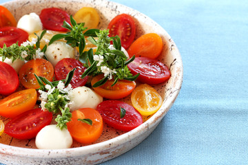 fresh salad with cherry tomatoes and basil