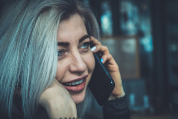 Beautiful young girl talking on a cell phone.