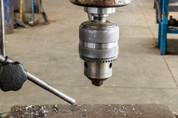 Drilling machine in factory workshop