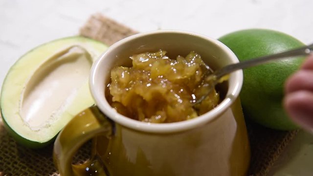 Mango Chunda or Sakhar Amba is a traditional indian summer recipe made using accha aam preserved in sugar syrup for days. selective focus