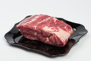 raw beef steak on plate