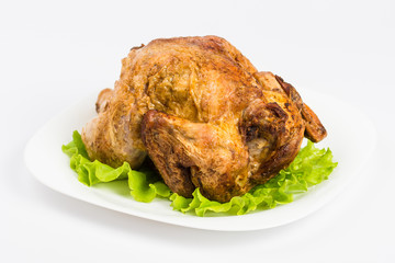 roasted chicken with vegetables on plate isolated on white