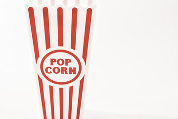 aged popcorn cup on white background 