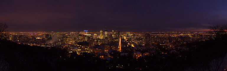 Fototapeta na wymiar Downtown Montreal city lights at dusk in winter, panorama