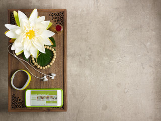 tray with stuff for aroma yoga and phone with trainer app