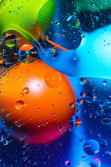Mixing water and oil on a beautiful color abstract background gradient balls circles and ovals