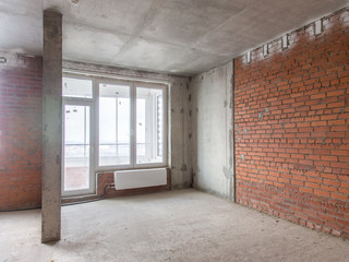 Concrete and brick walls in the apartment for repair