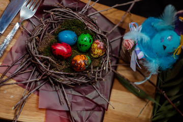 colorful Easter eggs quail in the nest
