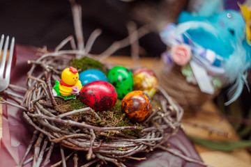 colorful Easter eggs quail in the nest