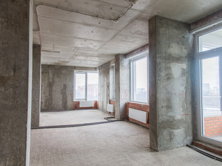 Fototapeta na wymiar Concrete and brick walls in the apartment for repair